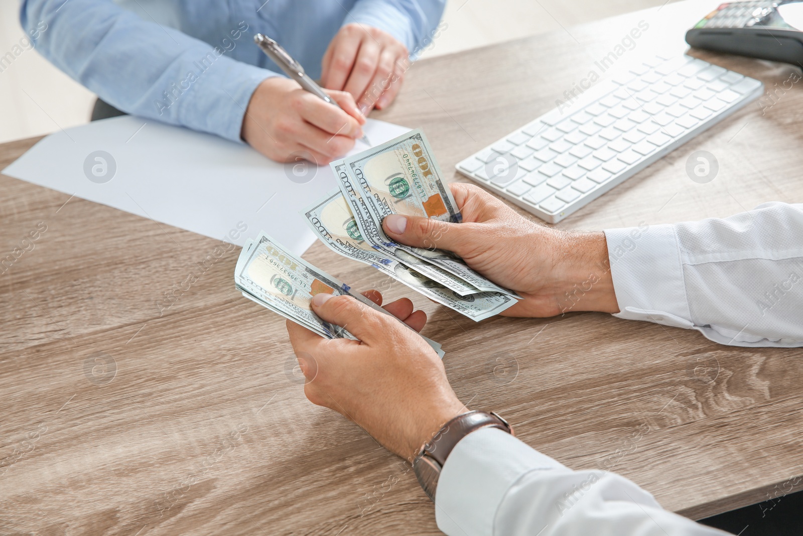 Photo of Man with money at cash department, closeup