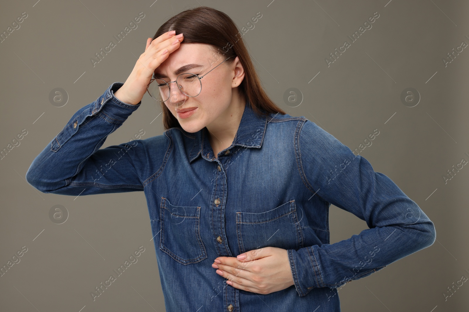 Photo of Woman having heart attack on grey background