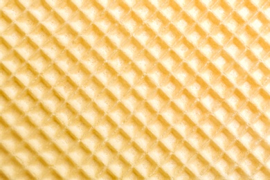 Photo of Tasty wafer as background, closeup. Crispy food