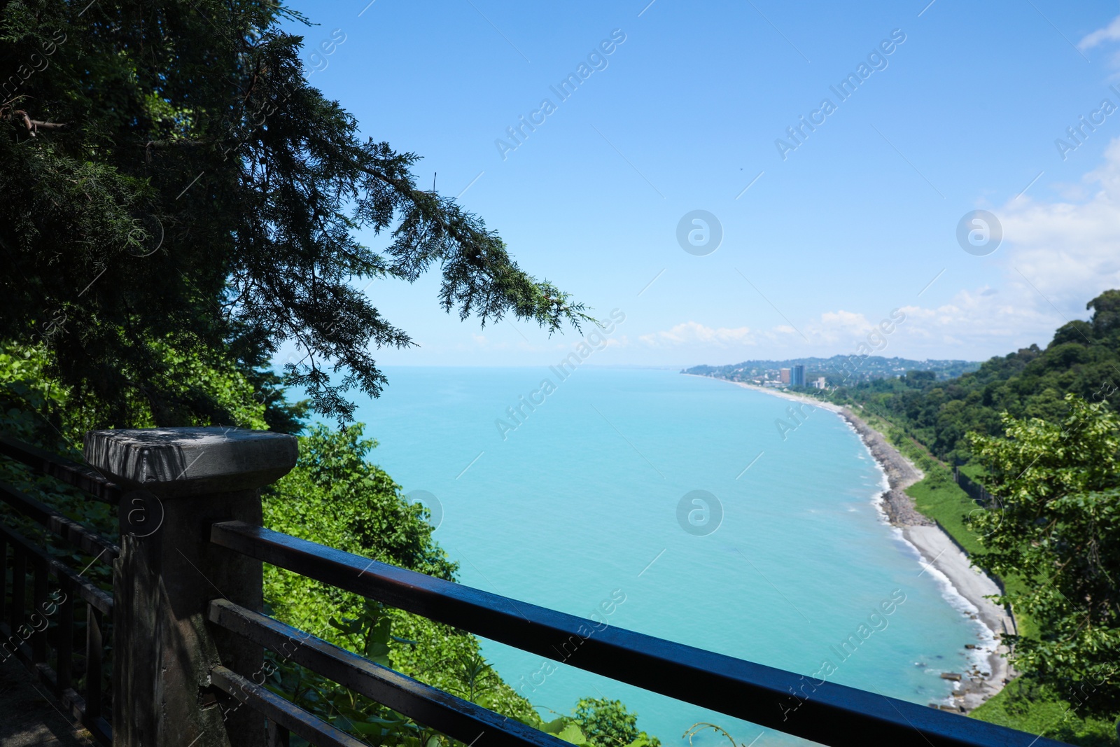 Photo of Picturesque view of distant city and beautiful sea on sunny day