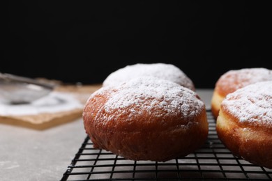 Photo of Delicious sweet buns on table against black background, closeup. Space for text
