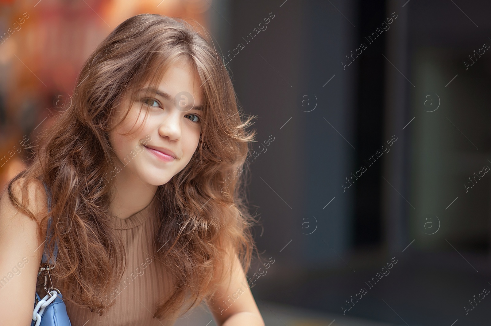 Photo of Portrait of beautiful teenage girl in shopping mall. Space for text