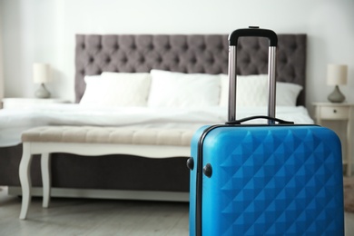 Photo of Travelling bag in hotel room