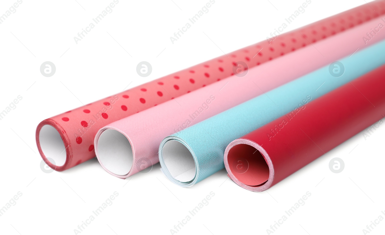 Photo of Rolls of colorful wrapping papers on white background