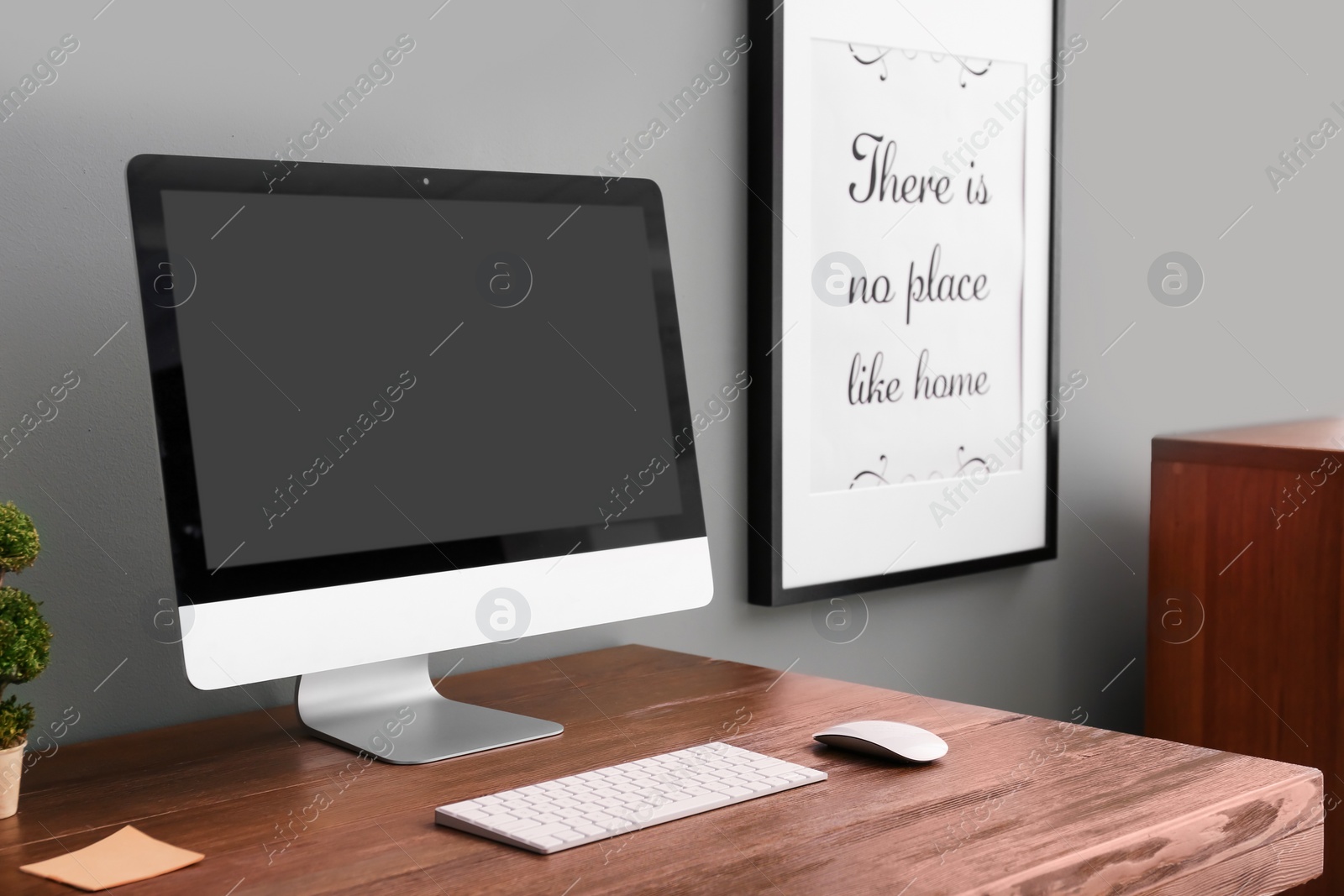 Photo of Comfortable workplace with computer on desk in home office