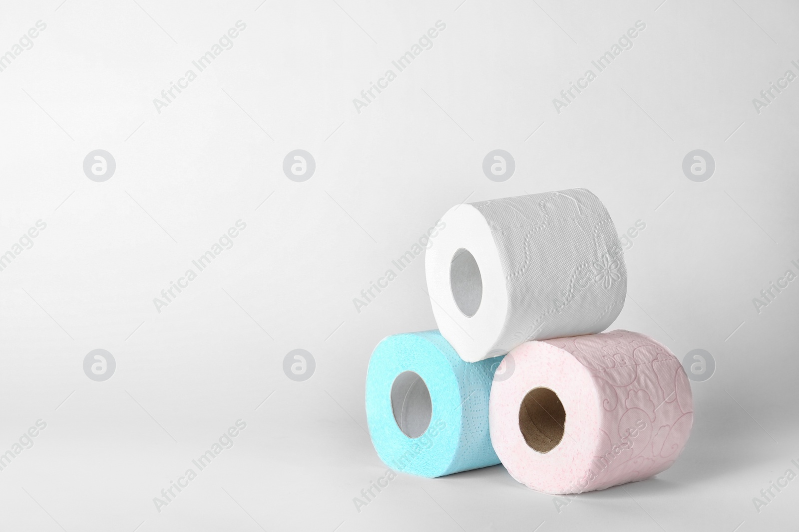 Photo of Rolls of toilet paper on white background. Space for text