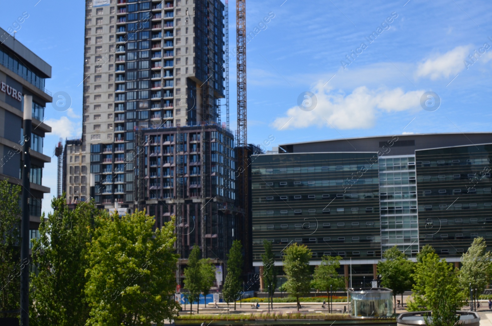 Photo of View of beautiful city with buildings and trees on sunny day