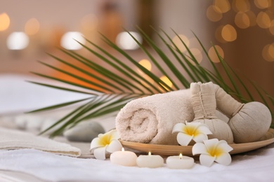 Beautiful spa composition on massage table in wellness center