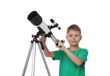 Happy little boy with telescope on white background