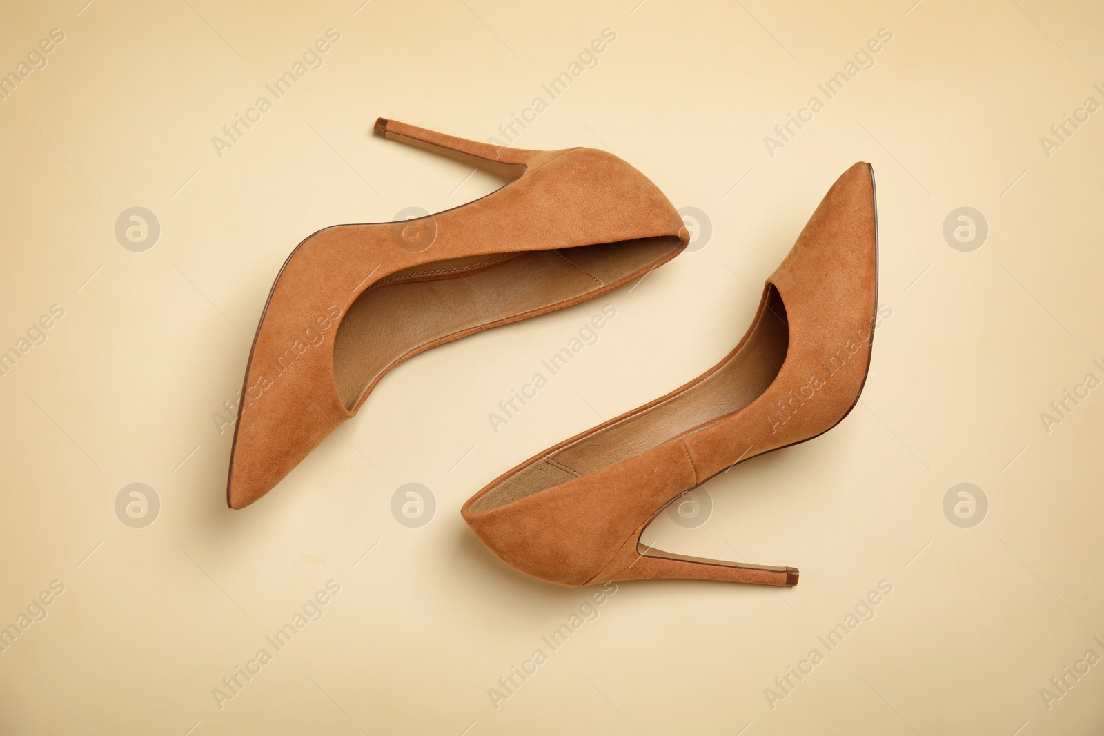 Photo of Pair of beautiful shoes on color background, top view