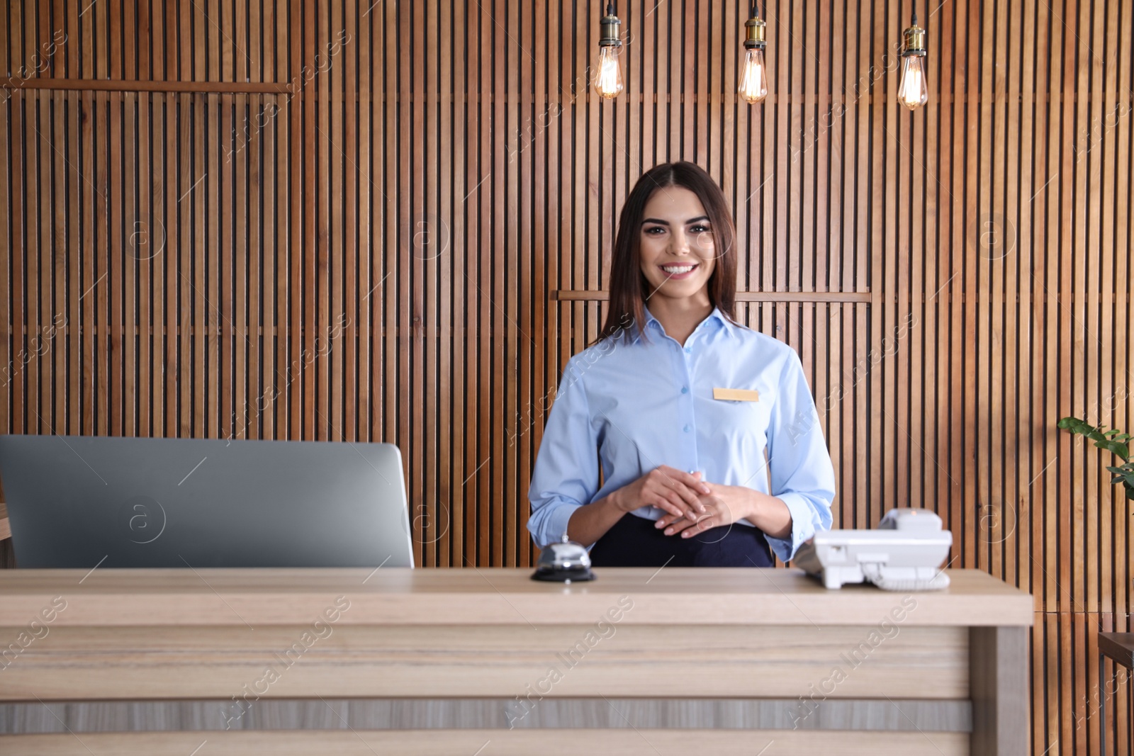 Photo of Portrait of receptionist at desk in lobby