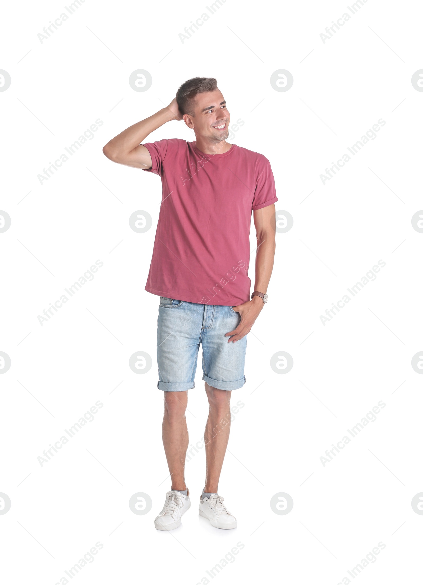 Photo of Handsome young man smiling on white background