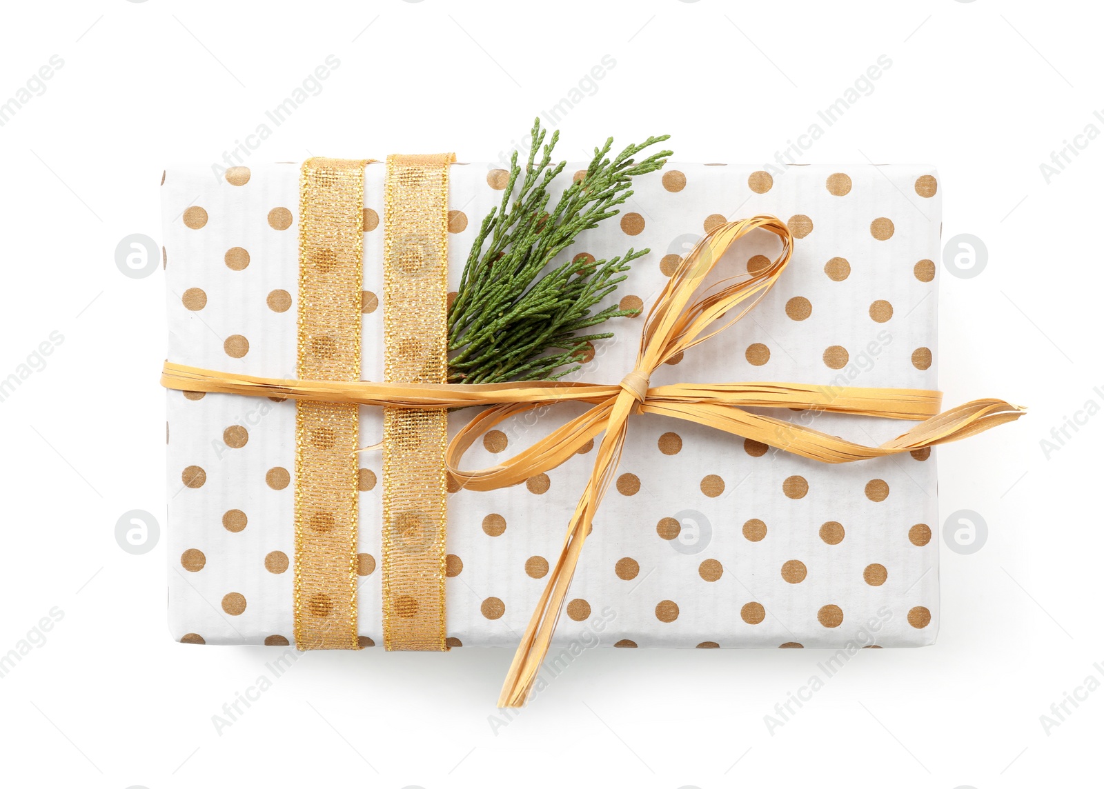 Photo of Christmas gift box decorated with fir branch isolated on white, top view