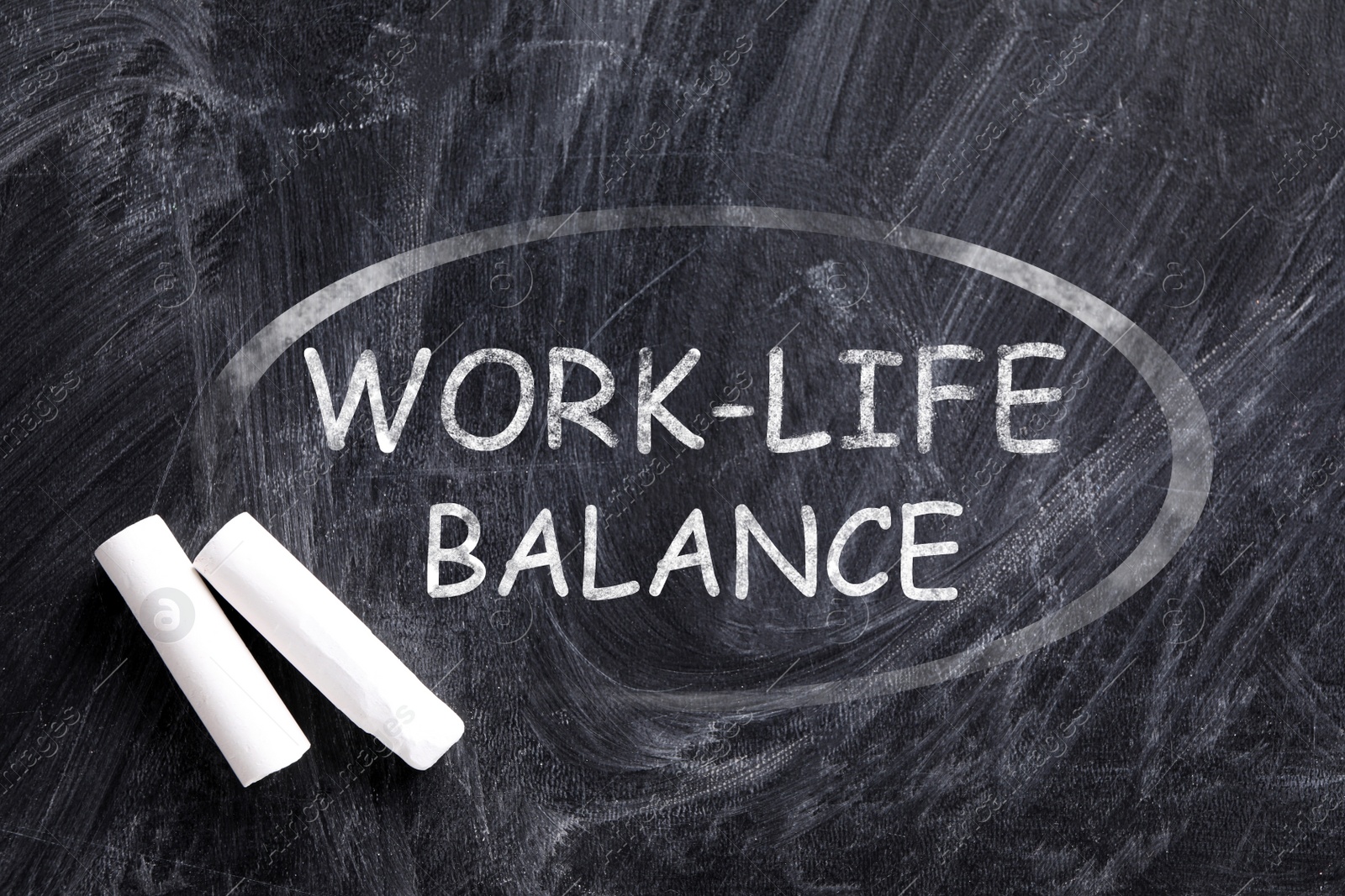 Image of Phrase Work-life balance written on blackboard, top view