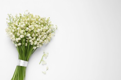 Photo of Beautiful lily of the valley bouquet on white background, top view