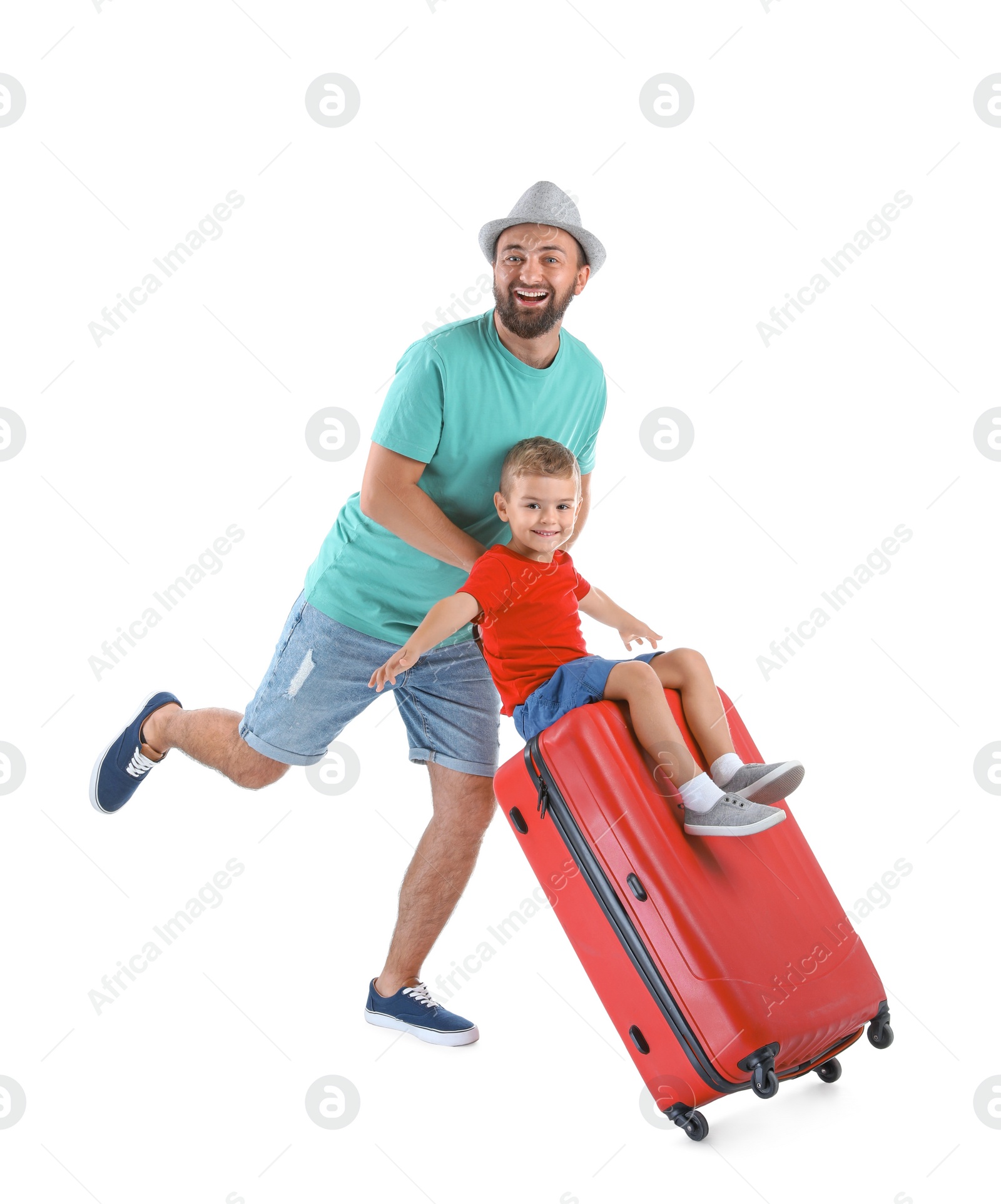 Photo of Man and his son playing with suitcase on white background. Vacation travel