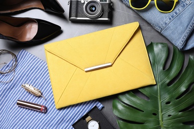 Flat lay composition with stylish bag and women's accessories on grey background