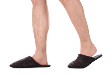 Photo of Man in warm soft slippers on white background, closeup