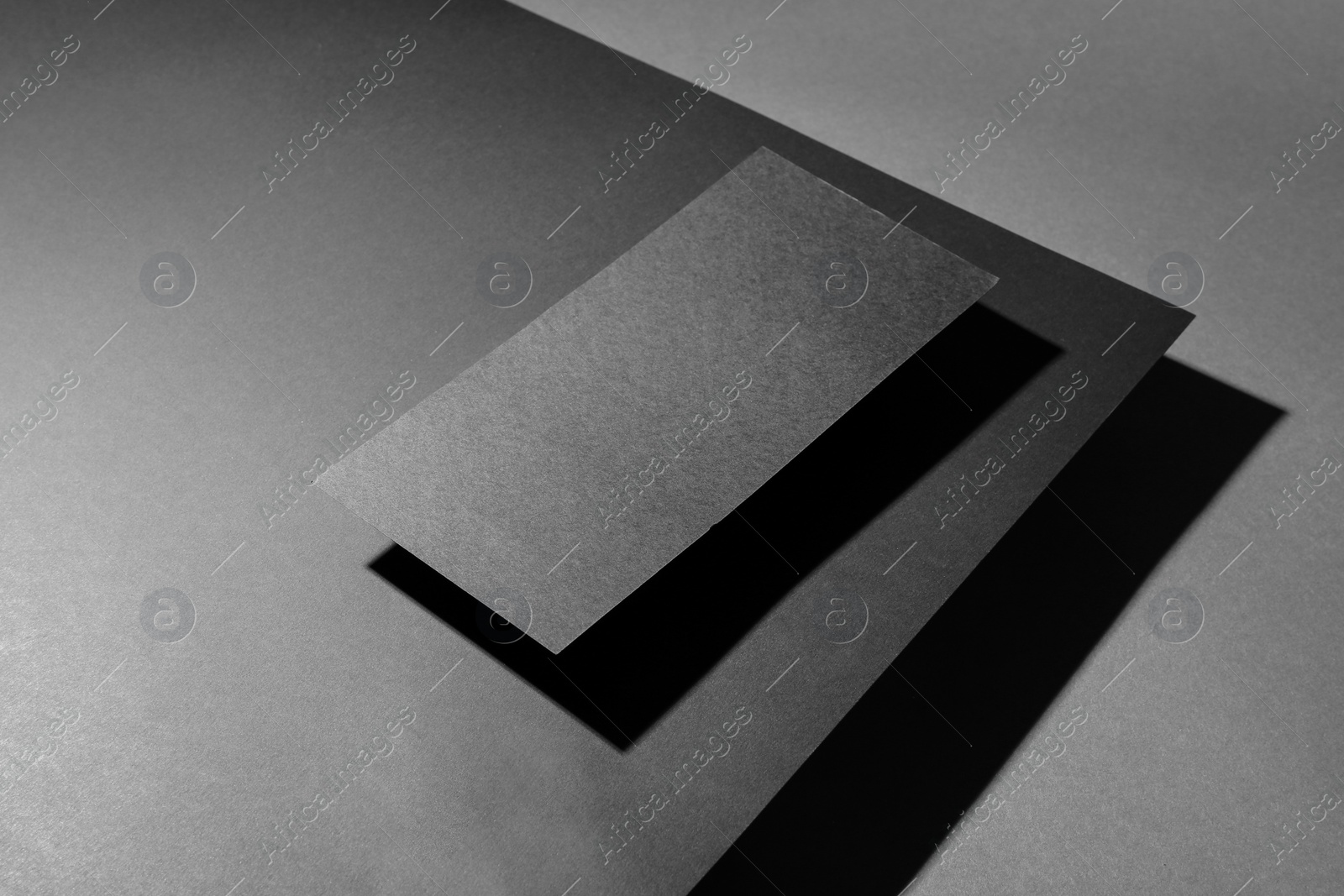 Photo of Black sheet on dark background. Mockup for design