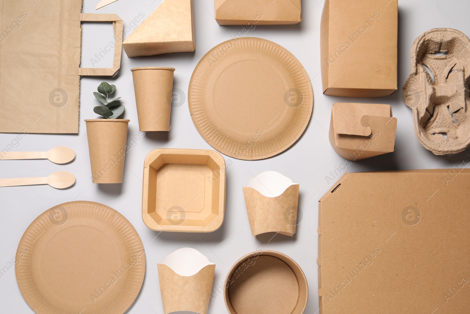 Photo of Flat lay composition with eco friendly food packagings on light grey background