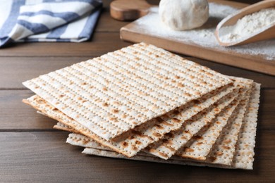 Photo of Stack of traditional matzos on wooden table