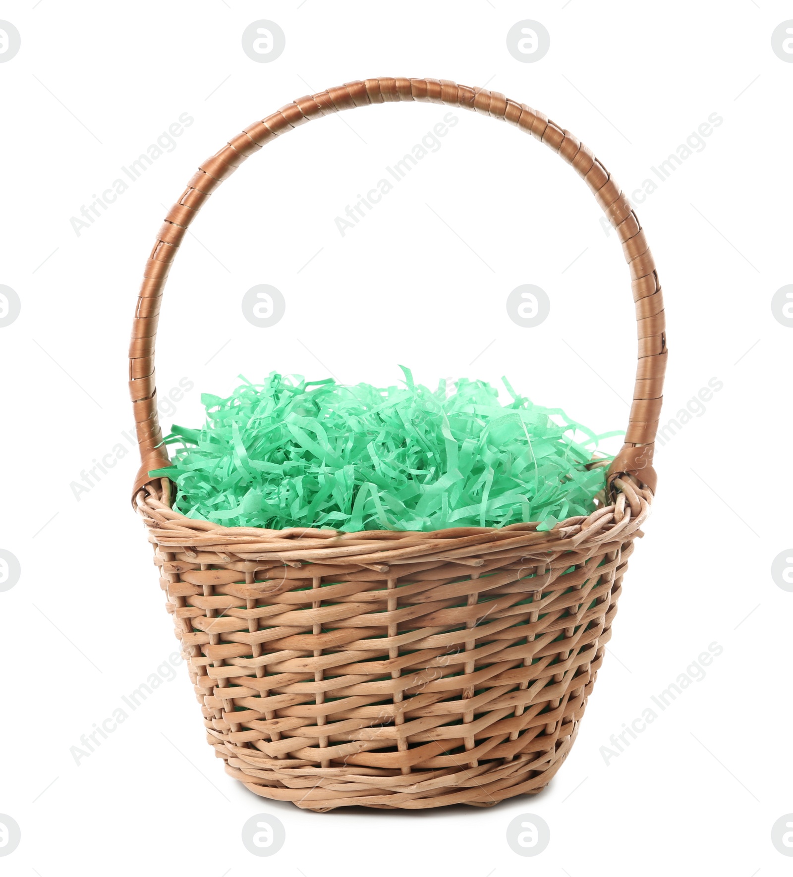 Photo of Easter basket with green paper filler isolated on white