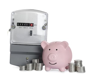 Electricity meter, piggy bank and stacked coins on white background
