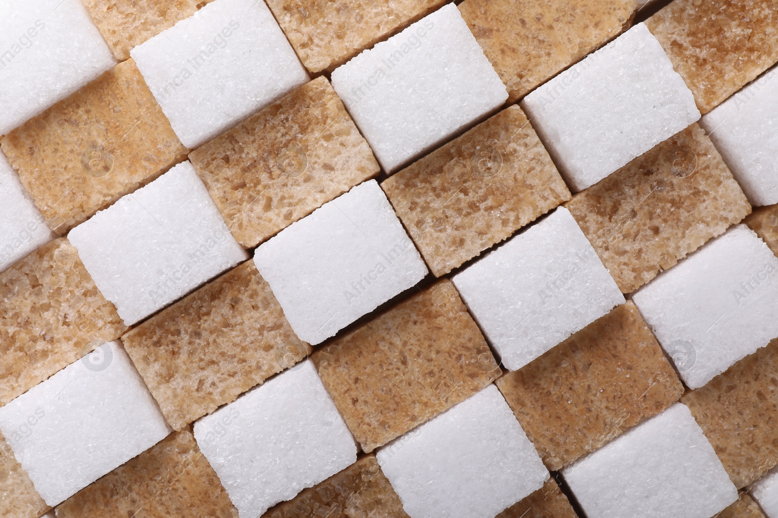 Photo of White and brown sugar cubes as background, top view