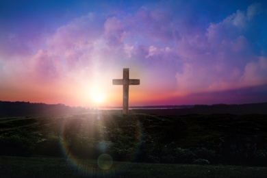 Image of Christian cross outdoors at sunrise. Resurrection of Jesus