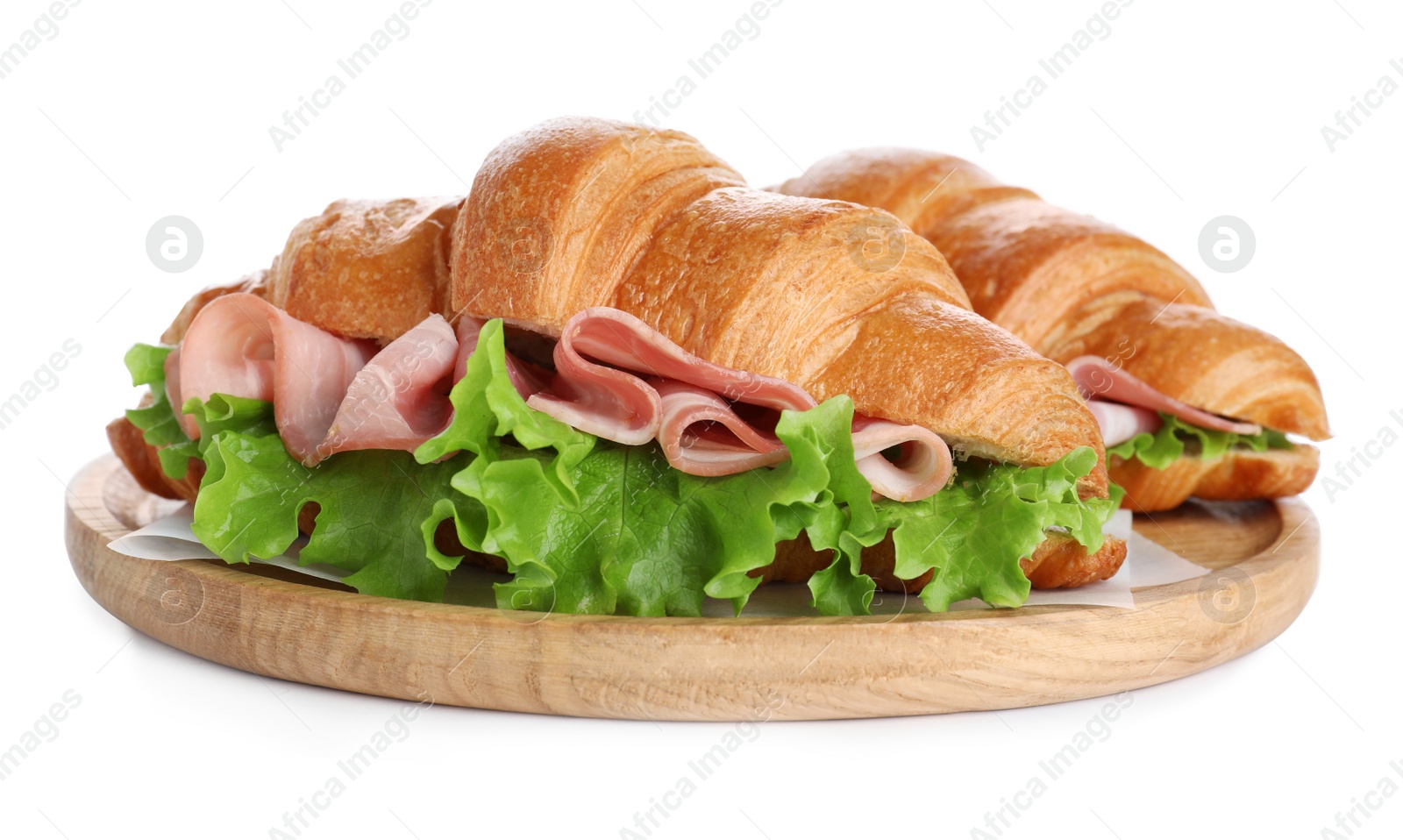 Photo of Wooden tray with tasty croissant sandwiches isolated on white