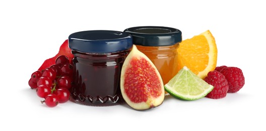 Jars of sweet jams and fresh ingredients on white background