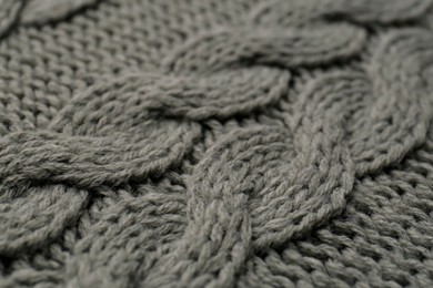 Photo of Knitted fabric with beautiful pattern as background, closeup