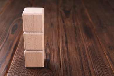 Photo of Cubes with abbreviation ISO on wooden table. Space for text