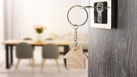 Image of Mortgage. Door with key open into room, space for text. Banner design