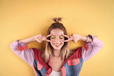 Photo of Beautiful young woman posing on color background. Summer fashion