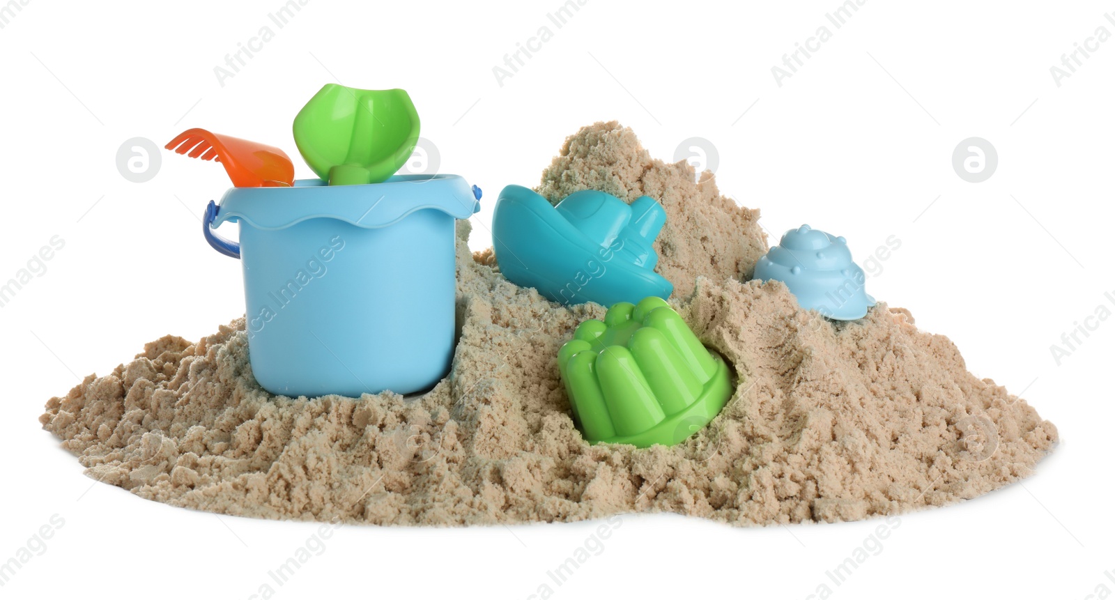 Photo of Plastic beach toys on pile of sand against white background. Outdoor play