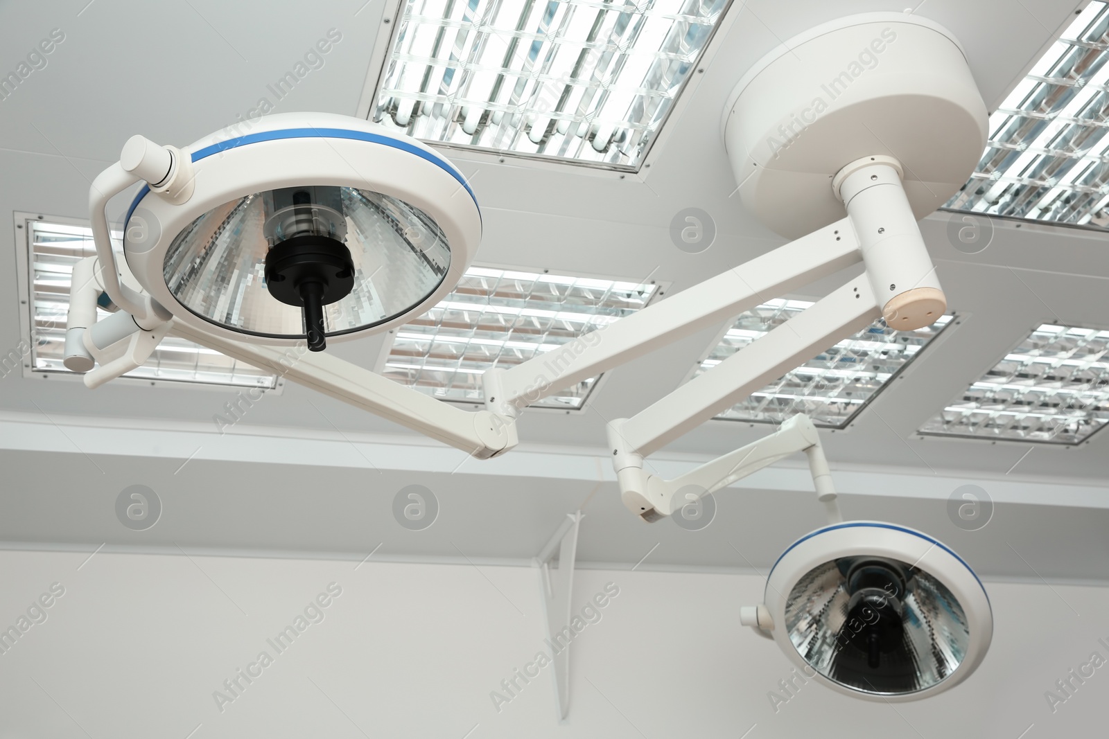 Photo of Powerful surgical lamps in modern operating room