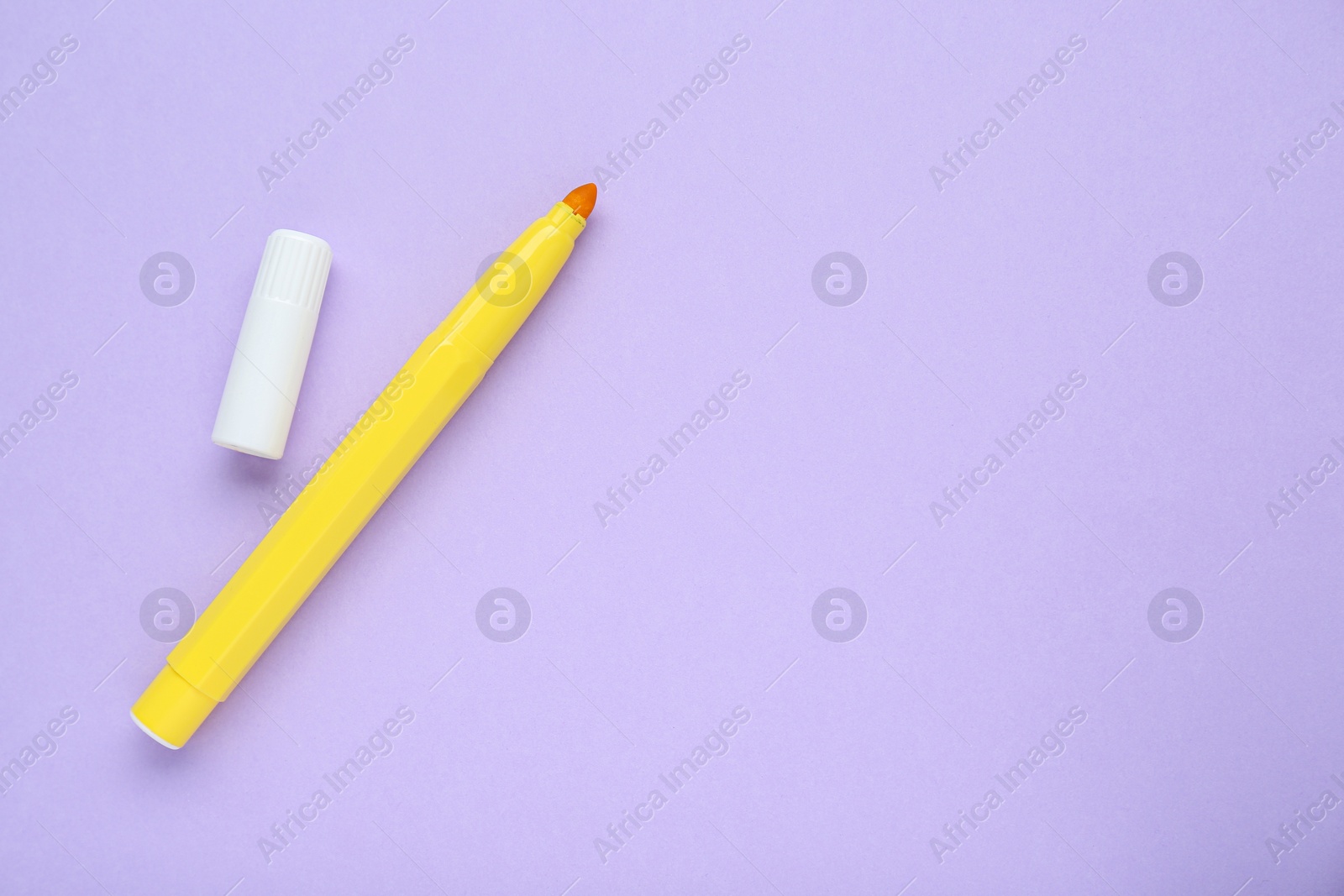 Photo of Yellow marker on light background, flat lay. Space for text