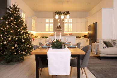 Photo of Cozy spacious kitchen decorated for Christmas. Interior design