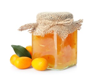 Delicious kumquat jam in jar and fresh fruits on white background