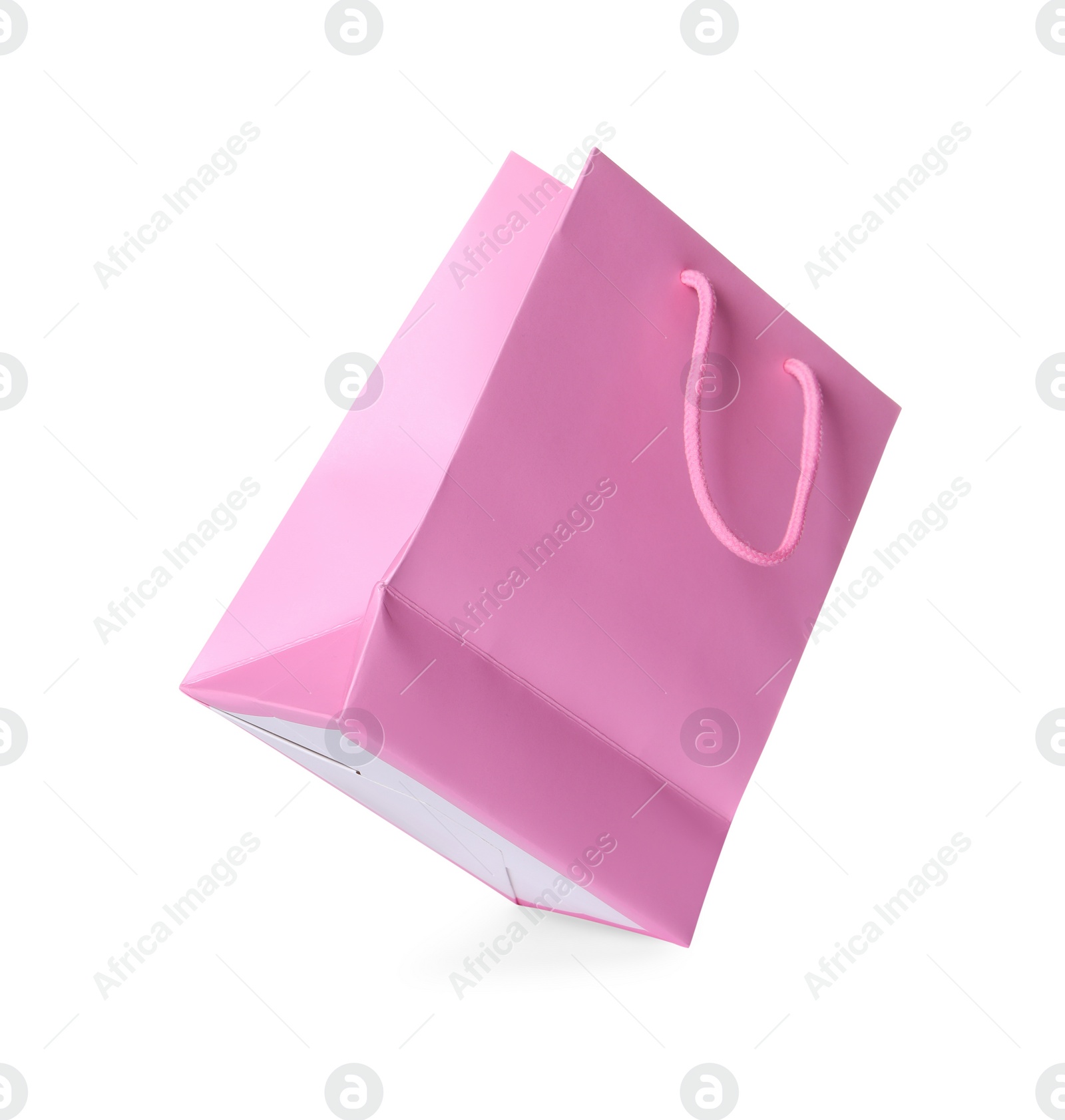 Photo of One pink shopping bag isolated on white