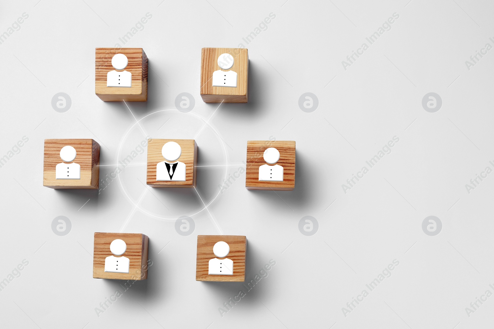 Image of Team management. Wooden cubes with human icons linked together symbolizing company structure on white background table, top view. Space for text