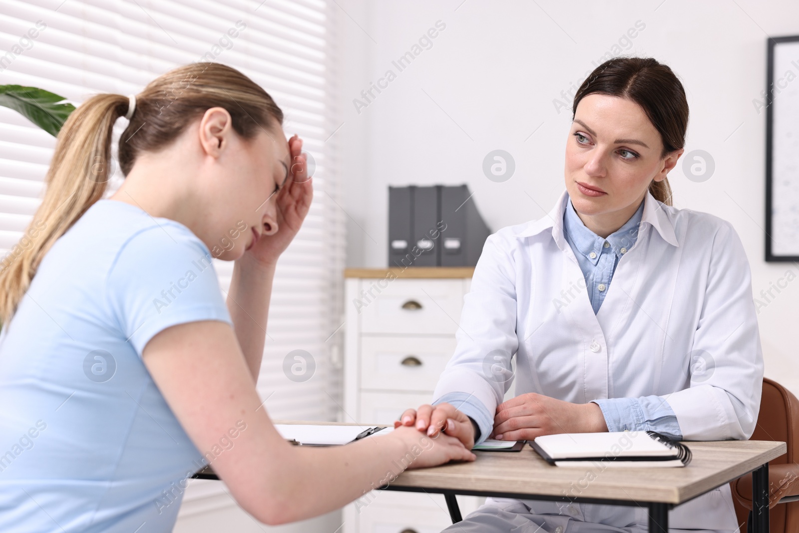 Photo of Mammologist's appointment. Doctor and woman in hospital