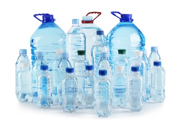 Set of different plastic bottles with pure water on white background