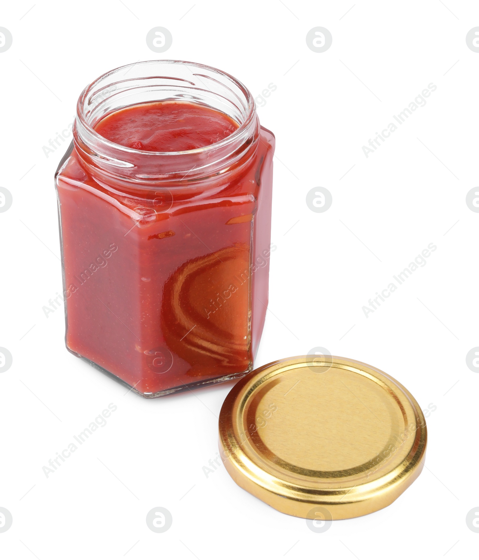 Photo of Organic ketchup in open jar isolated on white. Tomato sauce