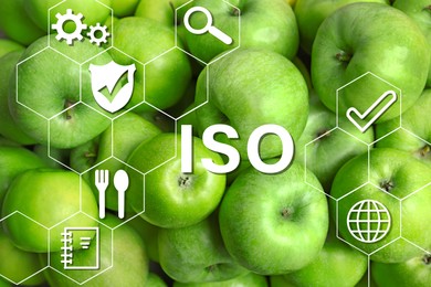 Image of ISO 22000 - Food safety management. Fresh green apples as background