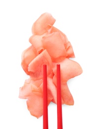 Photo of Chopsticks with pickled ginger on white background, top view