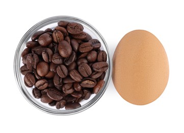 Photo of Easter egg painted with natural dye and coffee beans on white background, top view