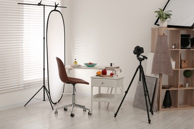 Professional equipment and composition with delicious spaghetti on white wooden table in studio. Food photography