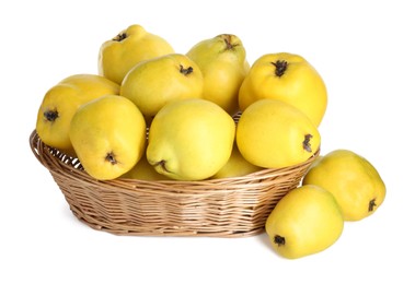 Photo of Basket with delicious fresh ripe quinces isolated on white